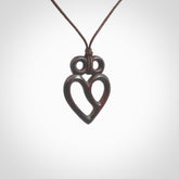 This is a hand carved love heart pendant made from a gorgeous and striking piece of red jasper stone. This is a superbly carved and very unique piece if custom jewellery. For sale online from NZ Pacific. Provided with an adjustable chocolate brown cord and packaged in a woven kete pouch.